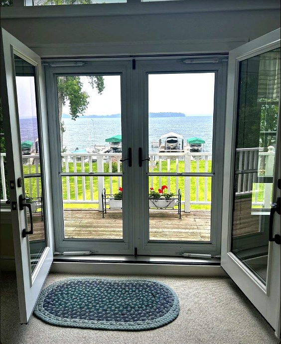 White Oak patio door installation with lake view
