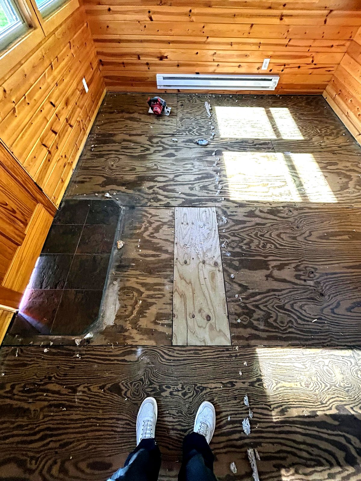 Before: cabin with old commercial windows